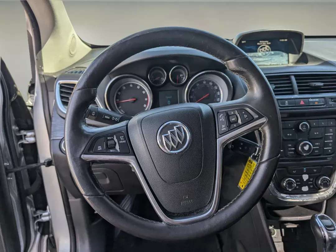2015 /Ebony Buick Encore Convenience (KL4CJBSB8FB) with an Turbocharged I4 1.4/83 engine, 6-Speed Automatic transmission, located at 804 22nd Ave, Phenix City, AL, 36870, (334) 297-1860, 32.484749, -85.024475 - 2015 Buick Encore Convenience - Photo#16