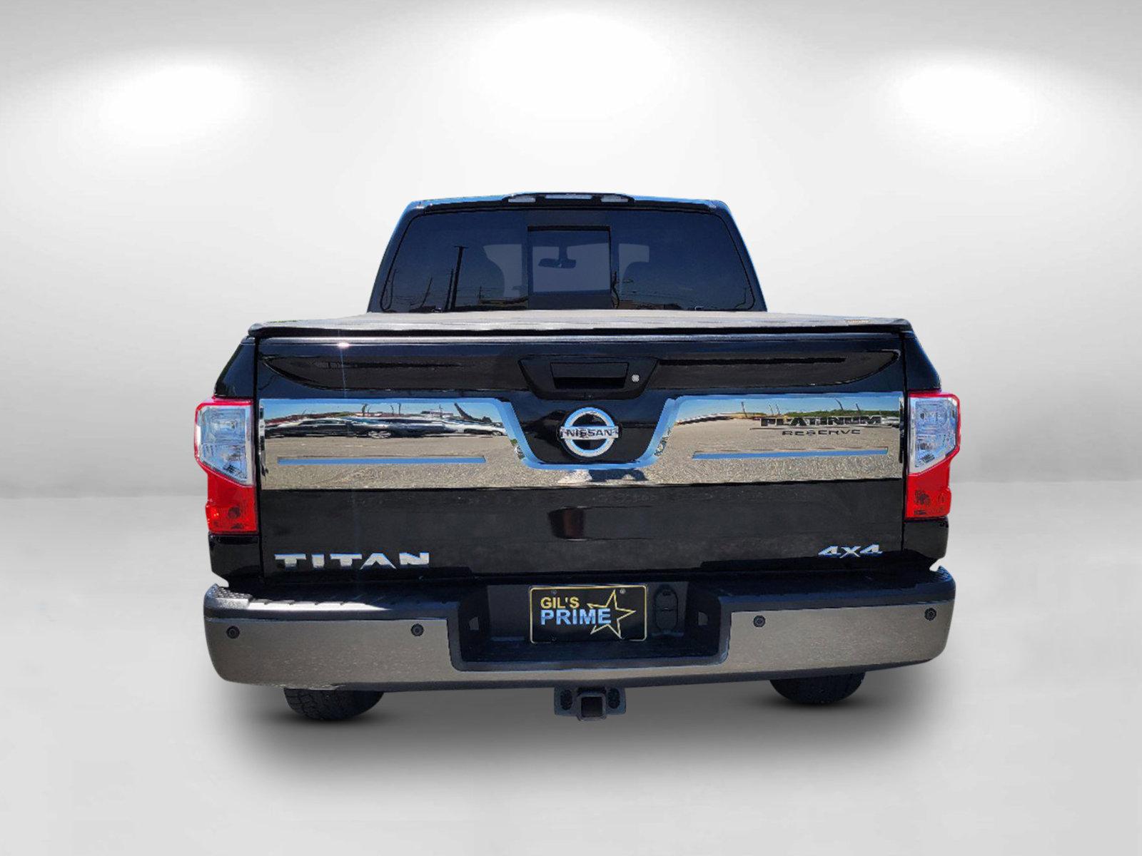 2018 Magnetic Black /Black/Brown Nissan Titan Platinum Reserve (1N6AA1E58JN) with an Regular Unleaded V-8 5.6 L/339 engine, 7-Speed Automatic w/OD transmission, located at 3959 U.S. 80 W, Phenix City, AL, 36870, (334) 297-4885, 32.469296, -85.135185 - 2018 Nissan Titan Platinum Reserve - Photo#5