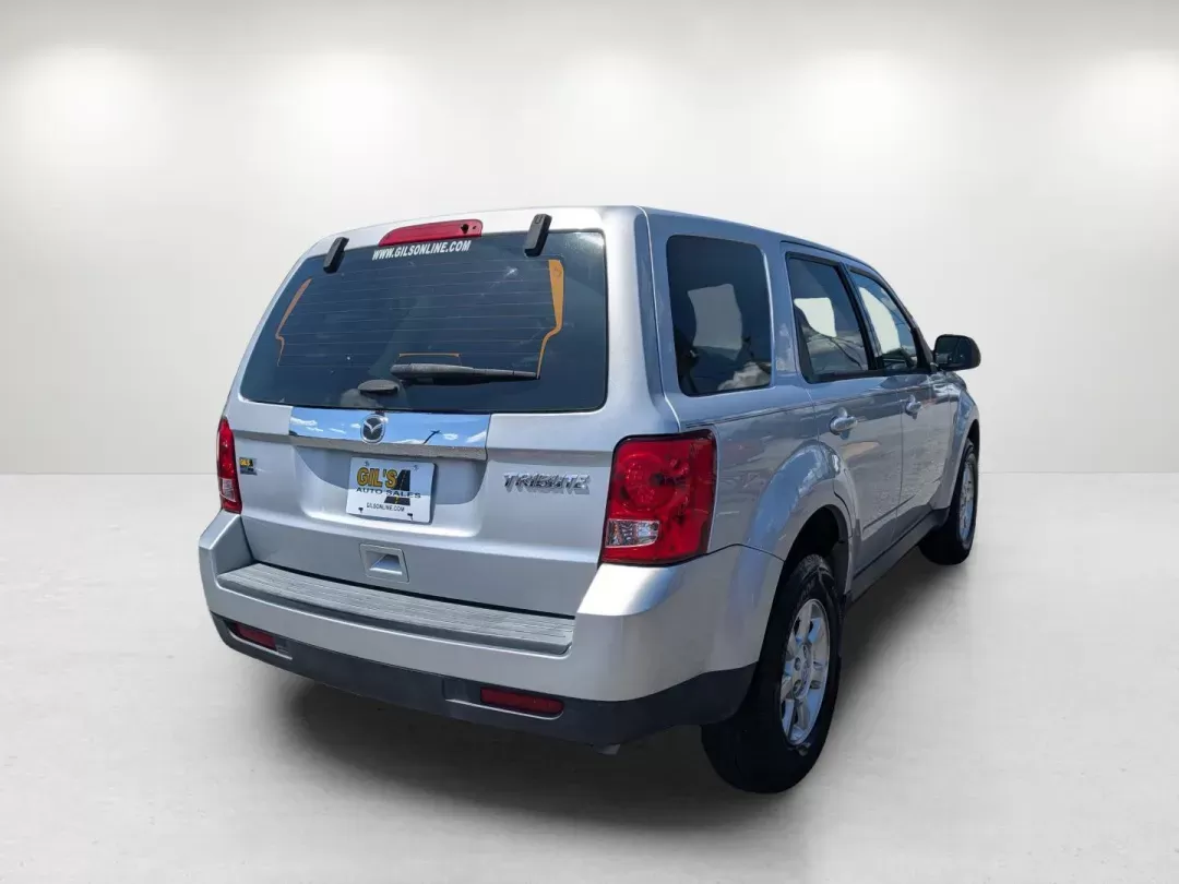 2011 /Charcoal Mazda Tribute Sport (4F2CY0C7XBK) with an Gas I4 2.5L/152 engine, 6-Speed Automatic transmission, located at 1430 Gateway Drive, Opelika, AL, 36801, (334) 239-0944, 32.637871, -85.409790 - 2011 Mazda Tribute Sport - Photo#4