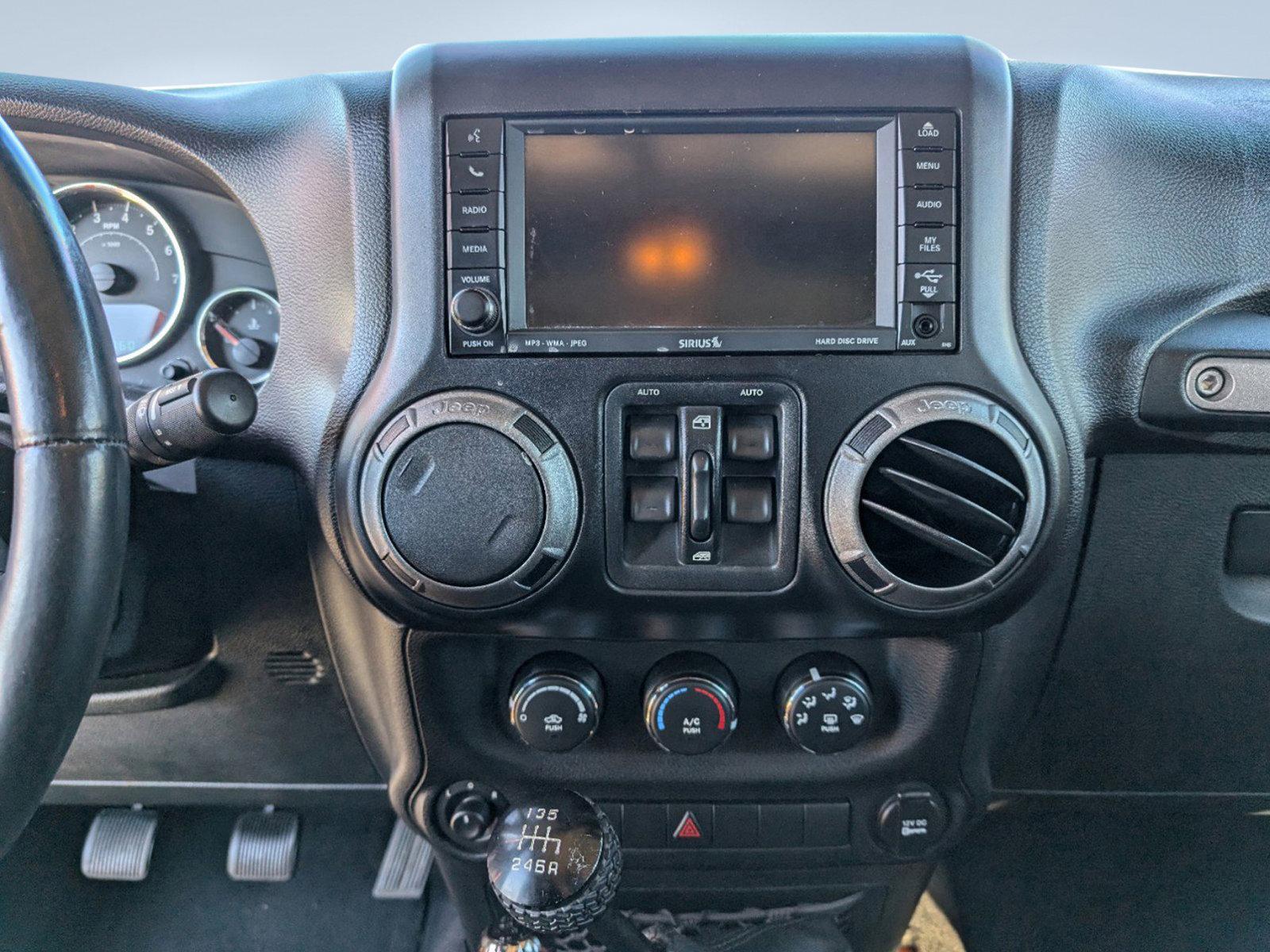 2012 /Black Interior Jeep Wrangler Unlimited Sport (1C4BJWDG0CL) with an Gas V6 3.6L/220 engine, 6-Speed Manual transmission, located at 3959 U.S. 80 W, Phenix City, AL, 36870, (334) 297-4885, 32.469296, -85.135185 - 2012 Jeep Wrangler Unlimited Sport - Photo#15