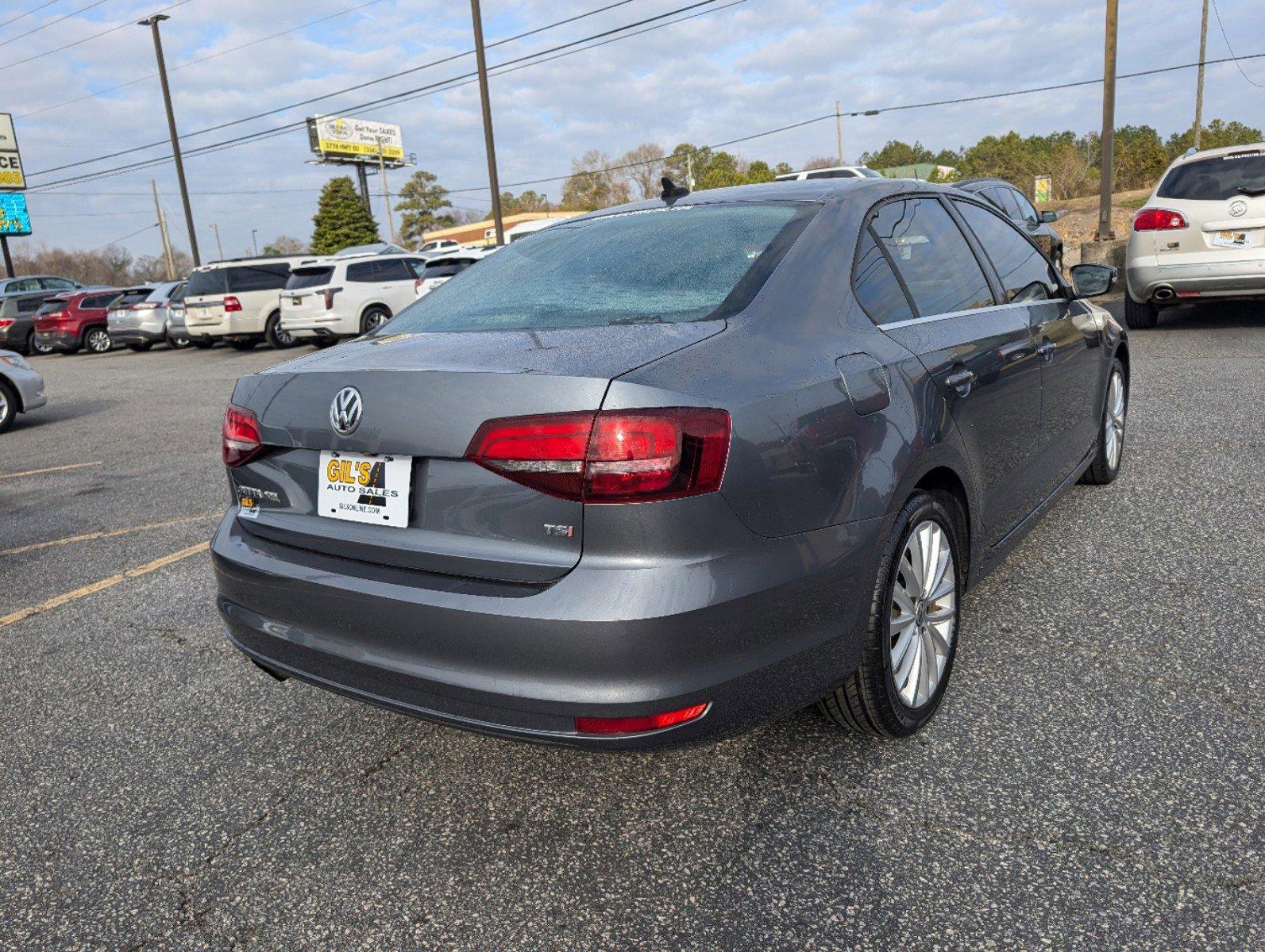 2016 Volkswagen Jetta Sedan (3VWL07AJ9GM) with an Intercooled Turbo Regular Unleaded I-4 1.8 L/110 engine, 6-Speed Automatic w/OD transmission, located at 3959 U.S. 80 W, Phenix City, AL, 36870, (334) 297-4885, 32.469296, -85.135185 - 2016 Volkswagen Jetta Sedan - Photo#4