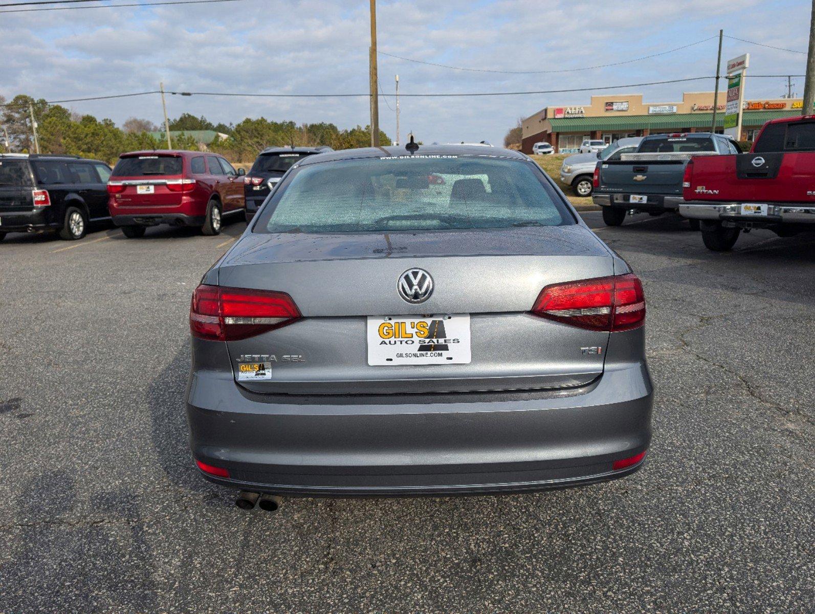 2016 Volkswagen Jetta Sedan (3VWL07AJ9GM) with an Intercooled Turbo Regular Unleaded I-4 1.8 L/110 engine, 6-Speed Automatic w/OD transmission, located at 3959 U.S. 80 W, Phenix City, AL, 36870, (334) 297-4885, 32.469296, -85.135185 - 2016 Volkswagen Jetta Sedan - Photo#5