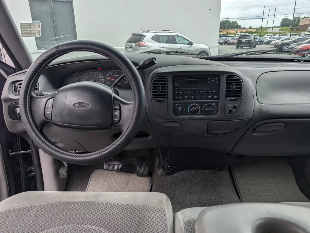 1999 Ford F-150 Work Series (1FTRX17WXXN) with an Other engine, located at 3959 U.S. 80 W, Phenix City, AL, 36870, (334) 297-4885, 32.469296, -85.135185 - **Discover the Perfect Workhorse: 1999 Ford F-150 Work Series at Gils Auto in Phenix City, AL!**<br /> <br /> Are you in need of a reliable pickup truck that can handle your daily tasks while keeping you comfortable on the road? Look no further than this rugged 1999 Ford F-150 Work Series, available - Photo#12