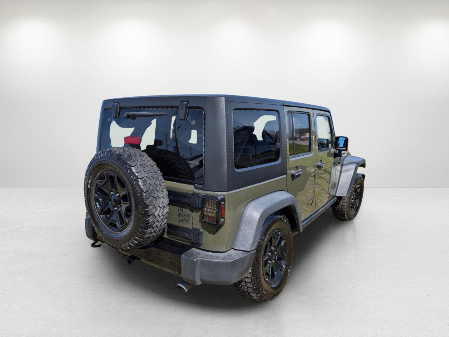 2016 /Black Jeep Wrangler Unlimited Willys Wheeler (1C4BJWDG9GL) with an Regular Unleaded V-6 3.6 L/220 engine, 6-Speed Manual w/OD transmission, located at 804 22nd Ave, Phenix City, AL, 36870, (334) 297-1860, 32.484749, -85.024475 - 2016 Jeep Wrangler Unlimited Willys Wheeler - Photo#4