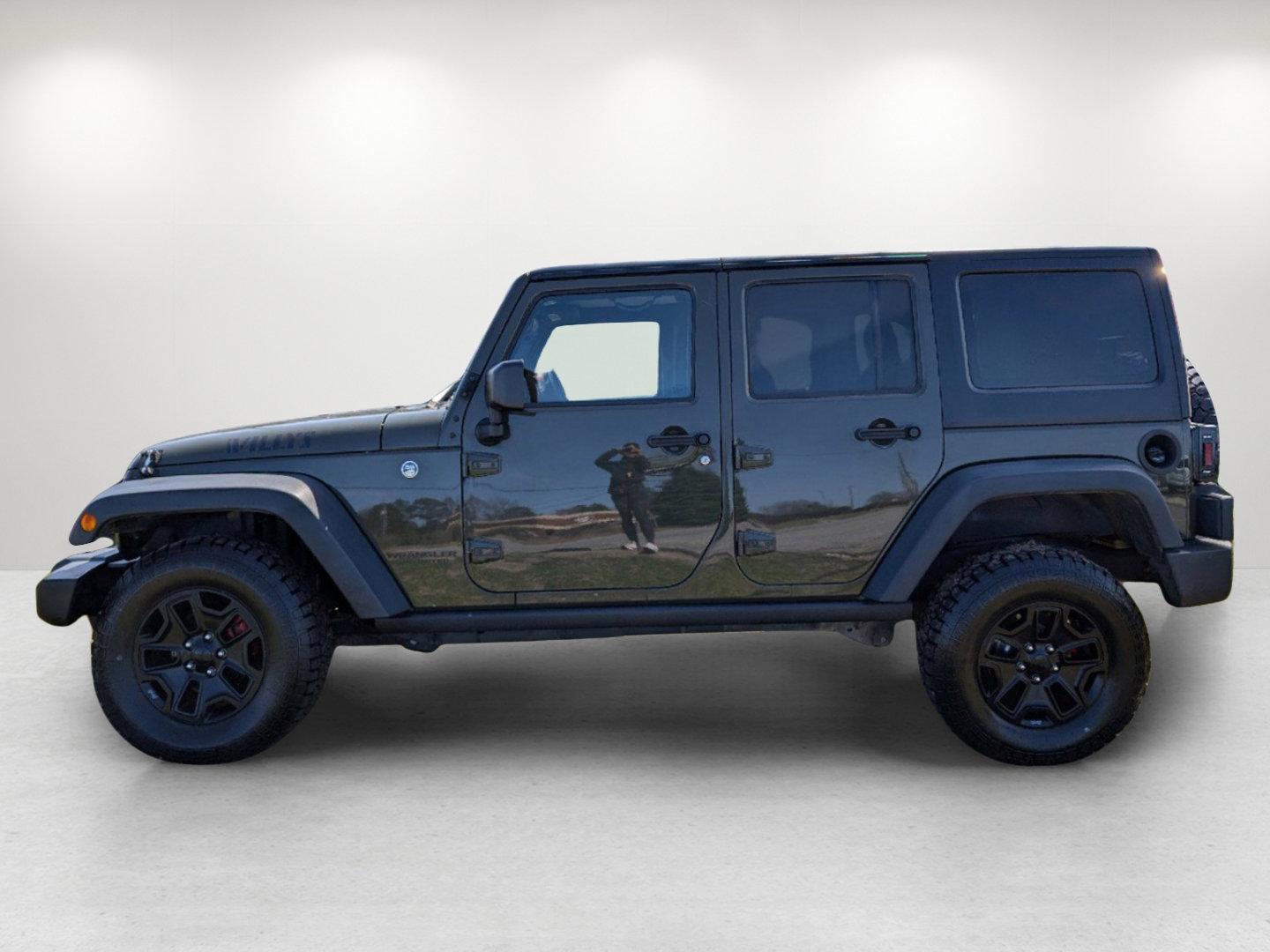 2016 /Black Jeep Wrangler Unlimited Willys Wheeler (1C4BJWDG9GL) with an Regular Unleaded V-6 3.6 L/220 engine, 6-Speed Manual w/OD transmission, located at 804 22nd Ave, Phenix City, AL, 36870, (334) 297-1860, 32.484749, -85.024475 - 2016 Jeep Wrangler Unlimited Willys Wheeler - Photo#7