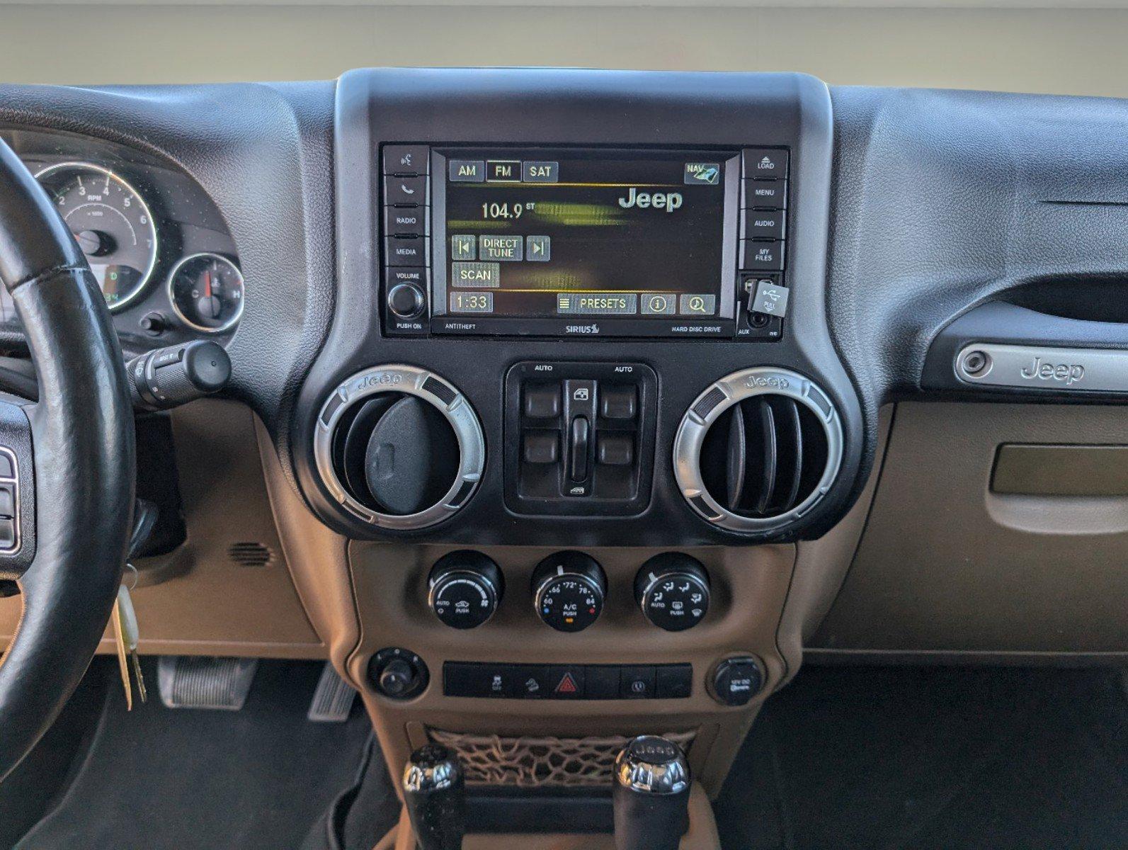 2013 /Black/Dark Saddle Interior Jeep Wrangler Unlimited Sahara (1C4BJWEG6DL) with an Gas V6 3.6L/220 engine, 5-Speed Automatic transmission, located at 804 22nd Ave, Phenix City, AL, 36870, (334) 297-1860, 32.484749, -85.024475 - 2013 Jeep Wrangler Unlimited Sahara - Photo#14